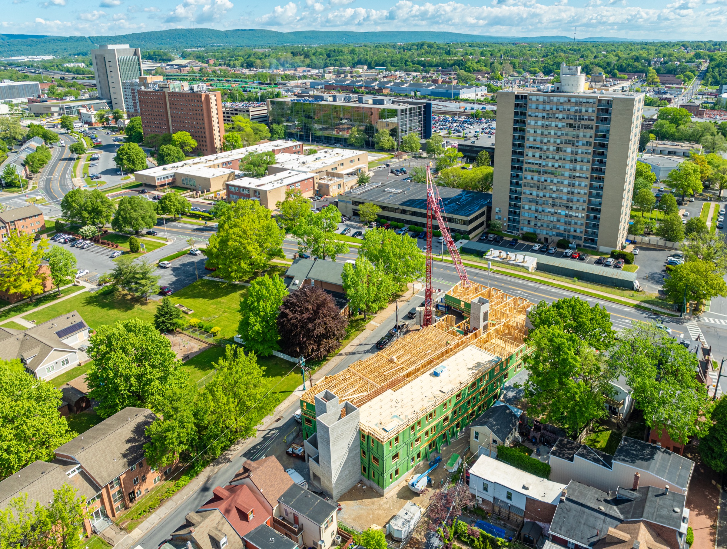 Panelized framing and concrete cores rising at Bethel Village
